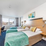 Anker hotellin kolmen hengen huone, kolme sänkyä