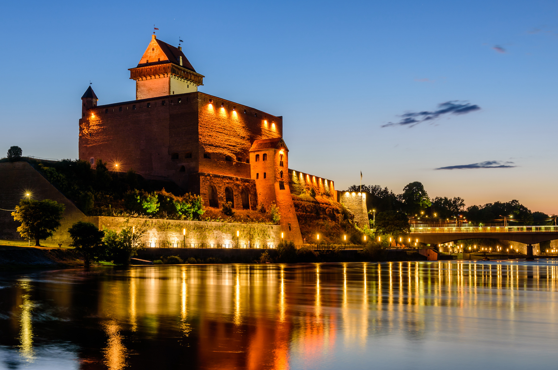 Sightseeing of Estonia. Beautiful night view of Narva Castle, Narva, Estonia